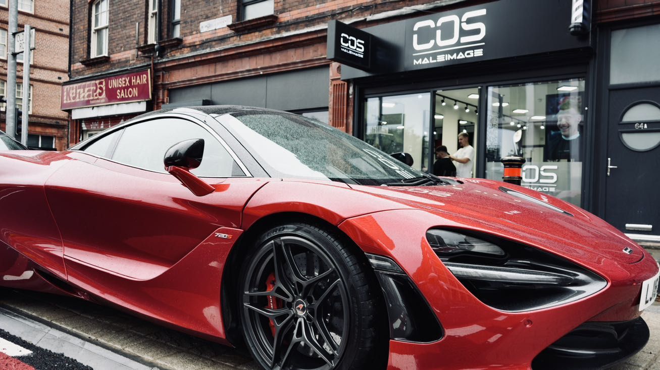 Red McLaren 720S outside the COS Male Image barbershop in Manchester